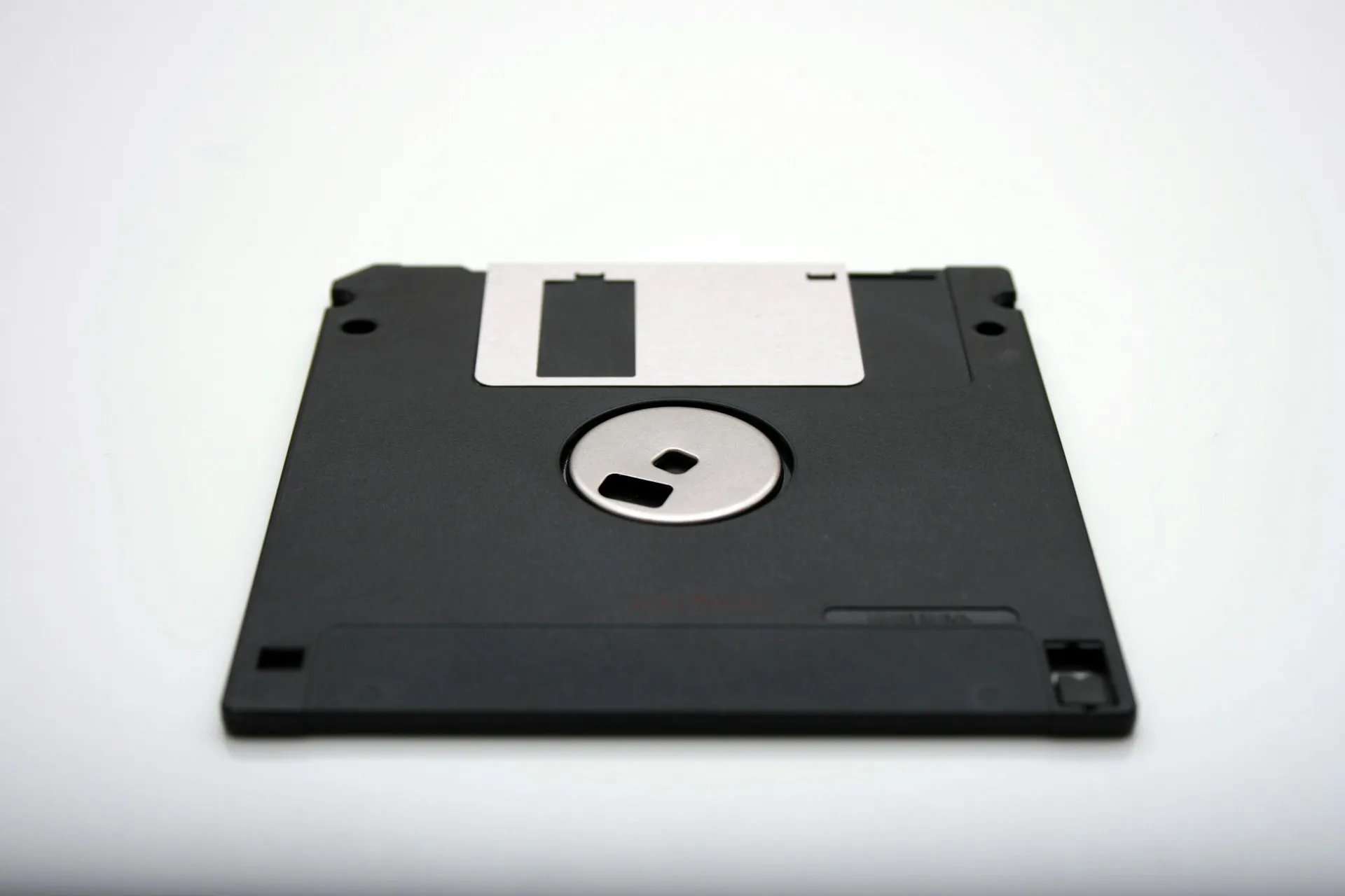 A backup is only useful if someone still has the software version, licence and operating system needed to open it. Audit the file and the toolchain together. Single black floppy diskette with a metal shutter lying on a plain white surface