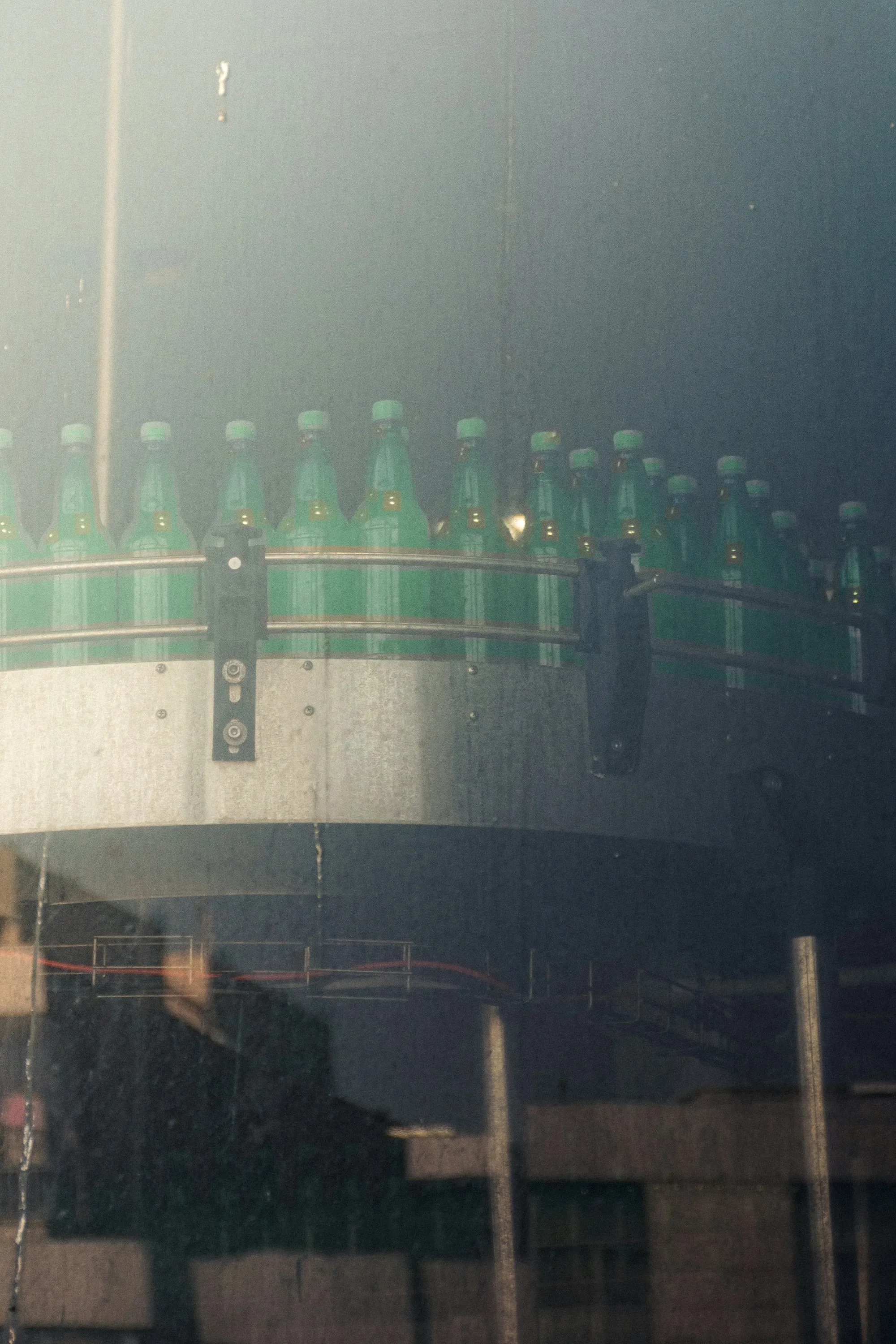 Bottles moving along a factory conveyor