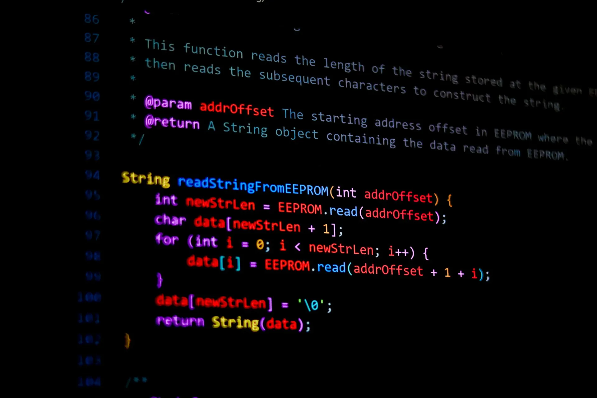 Git reads a change like this line by line. A binary PLC project gives it nothing to read, only the fact that the file changed. Dark code editor showing a commented function that reads stored data from device memory