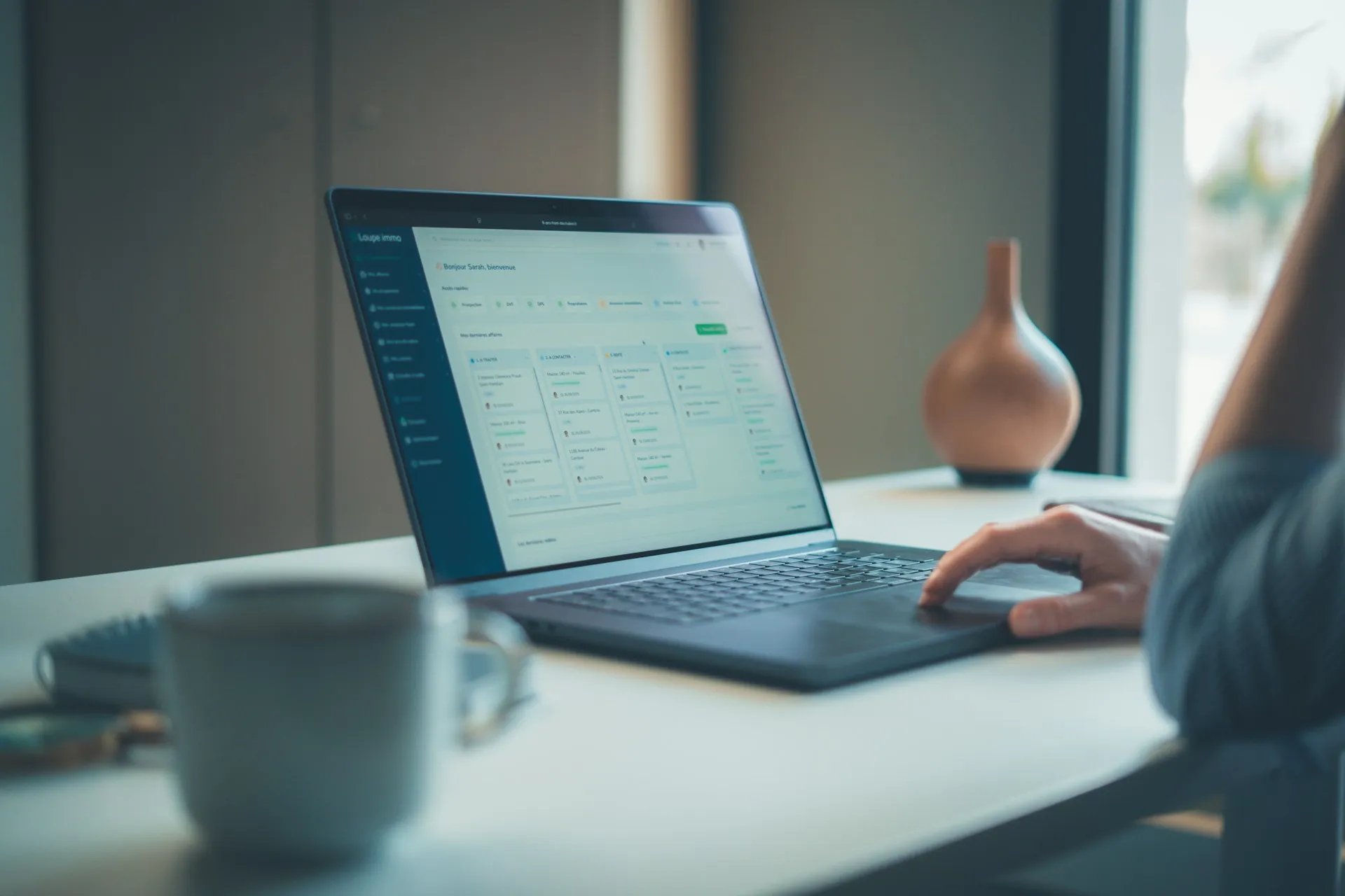 Most failed upgrades of a backup tool are decided at a desk: the known issues and dropped device support were in the release notes nobody read. Person reviewing a list of items on a laptop at a bright desk beside a coffee cup