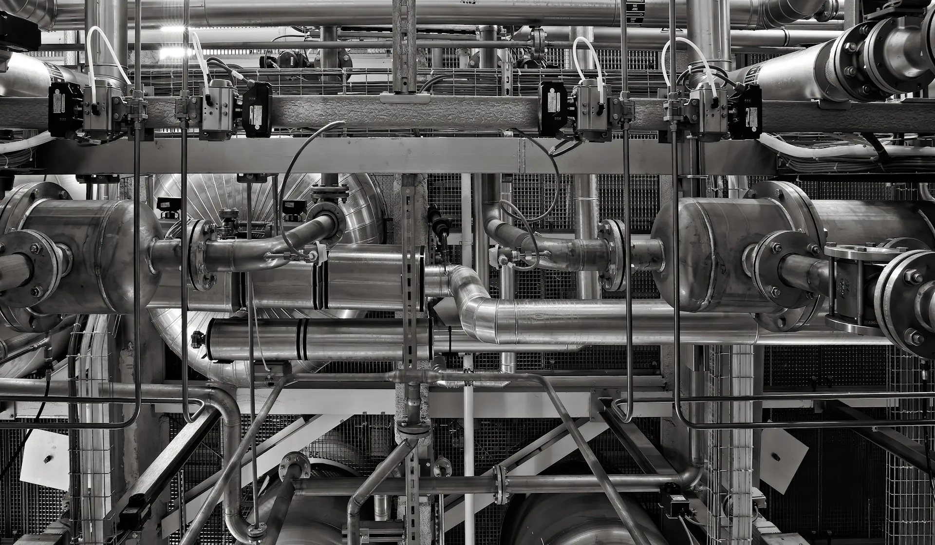 Every instrument on a skid like this is a tag. Which ones you keep, how often and for how long are decisions, not defaults. Stainless process piping with valve actuators and instrument tubing on an industrial plant skid