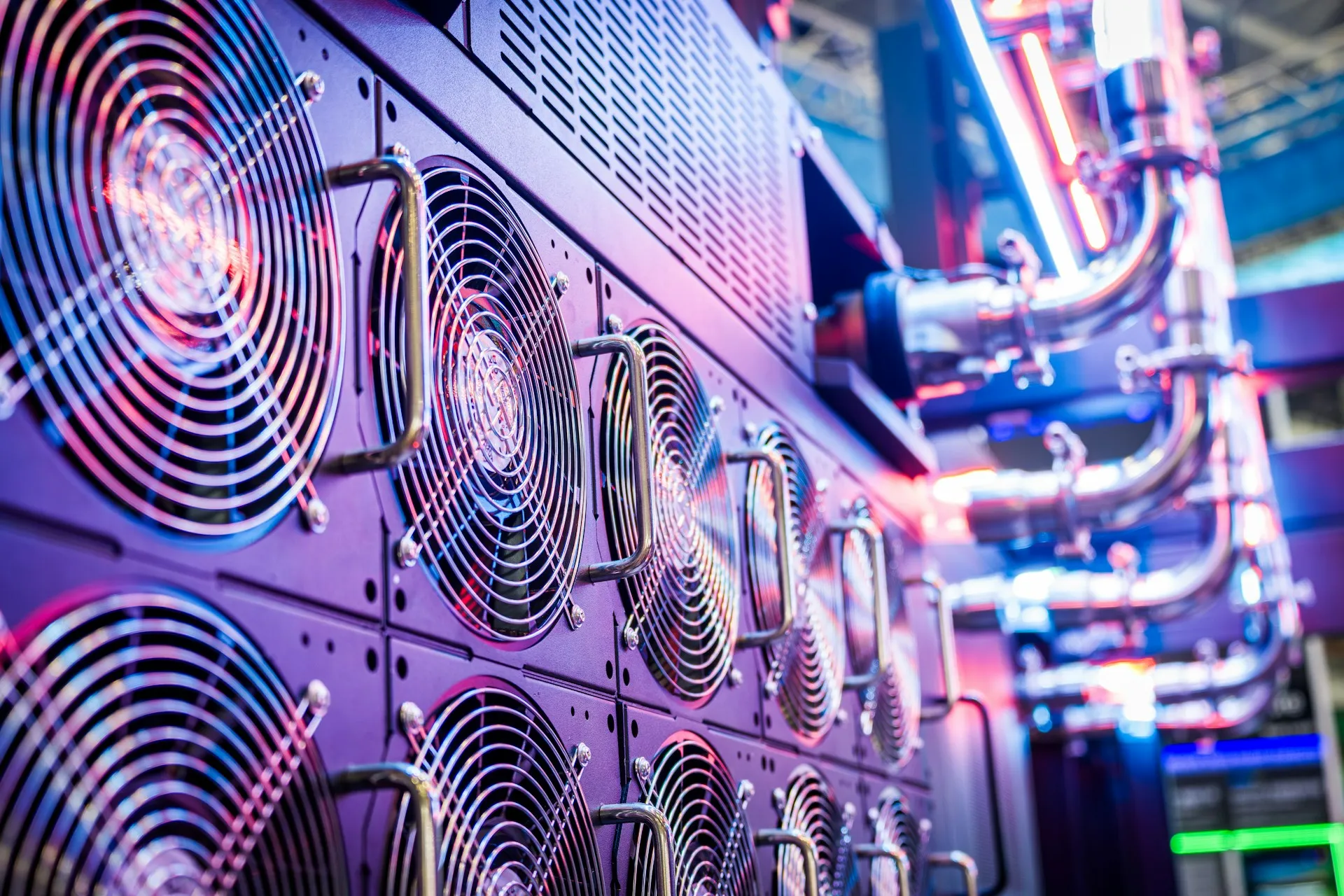 Software brokers run on compute you already cool, power, patch and monitor, which is usually the deciding argument against another specialised box. Wall of server cooling fans lit in purple and pink with pipework to the side